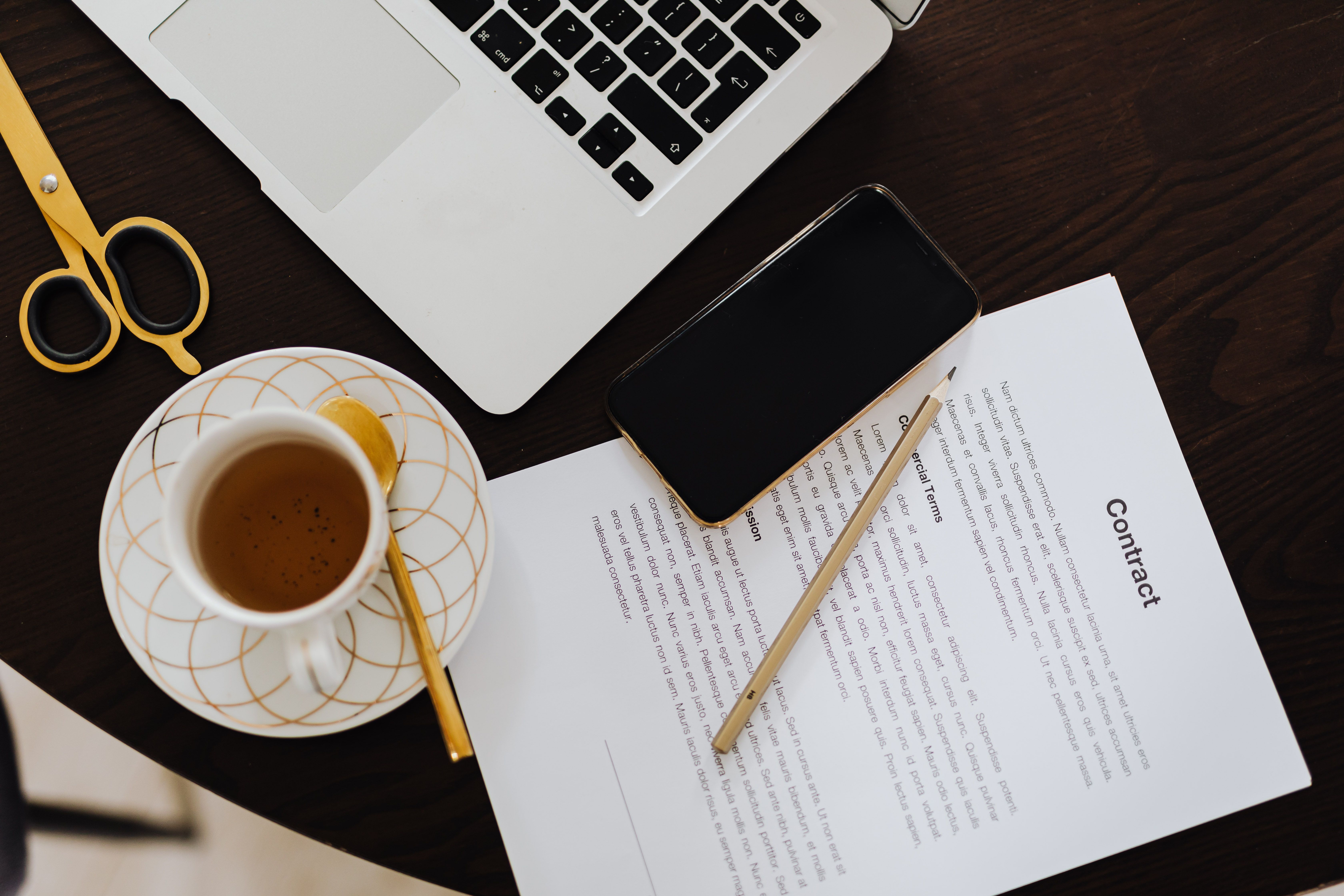 Contract commercial terms document on desk for pre-signing review